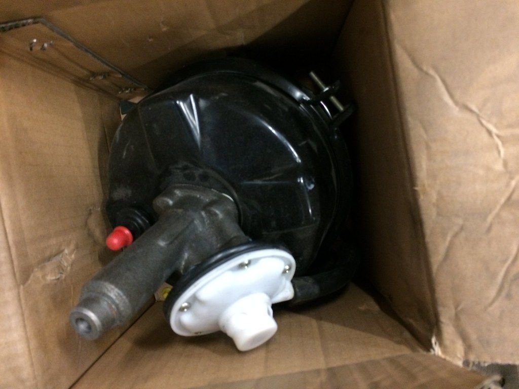 Replacement brake booster with master cylinder attached, still in its shipping box before installation