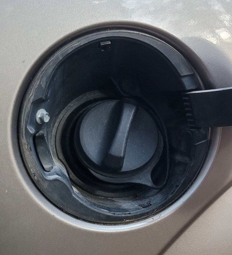 Open fuel door showing the gas cap, a common cause of EVAP check engine codes
