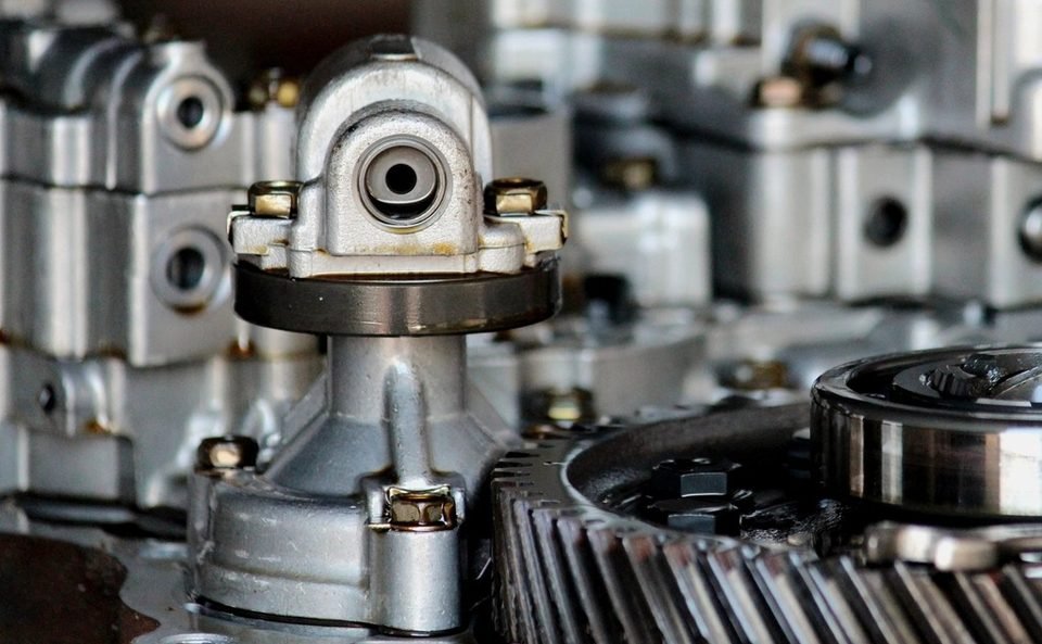 Close-up of engine components near where crankshaft and camshaft sensors are mounted