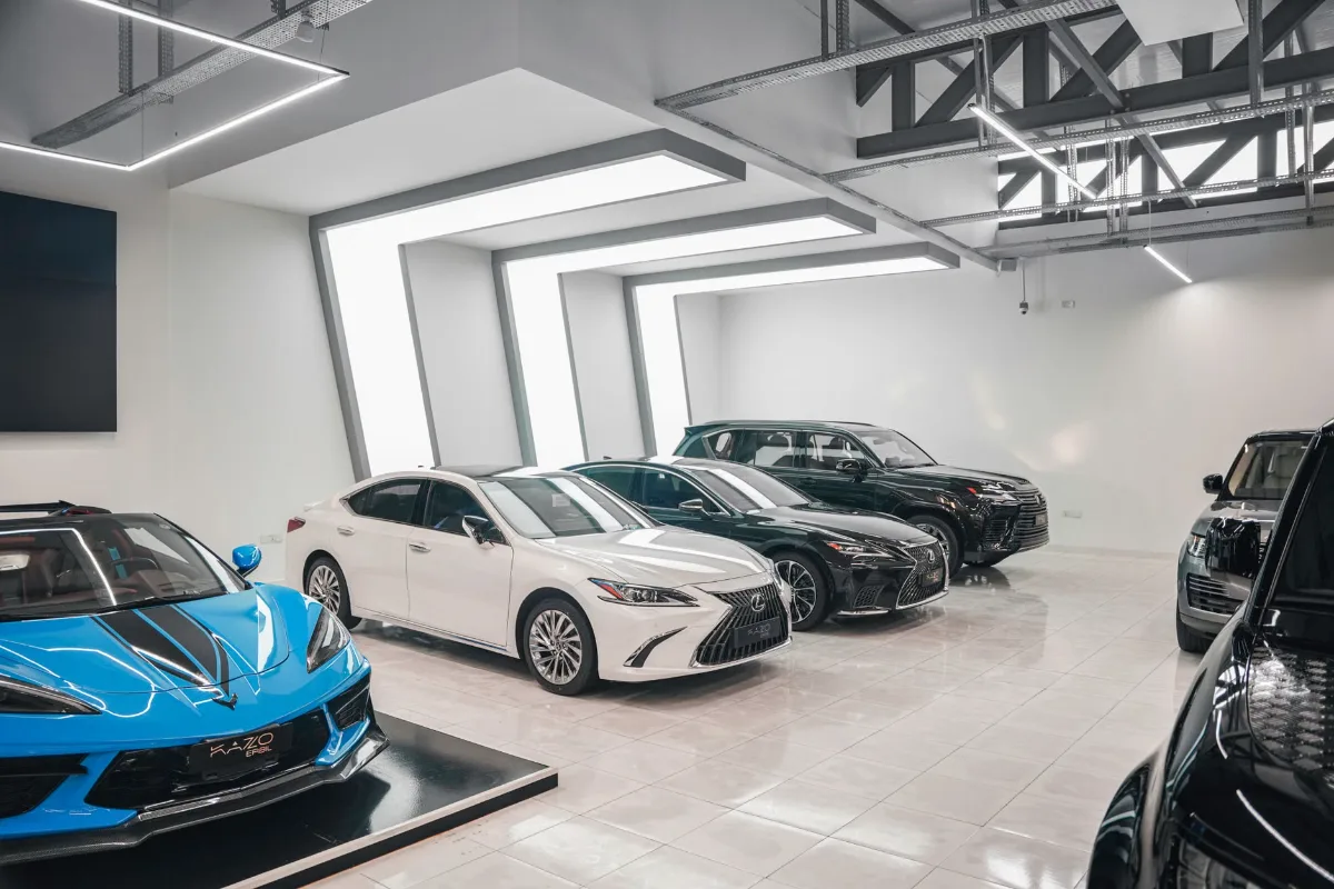 Sleek luxury cars showcased in a stylish, modern automotive dealership