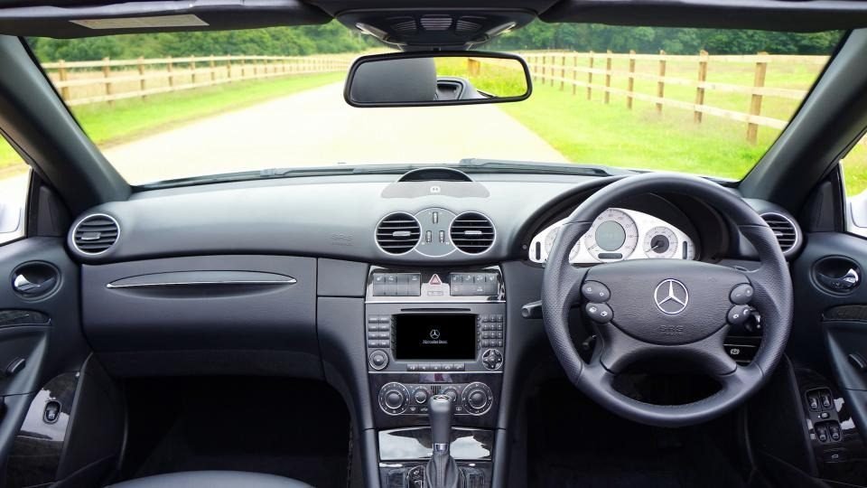 Driver view of a car steering wheel, which turns the rack and pinion that steers the front wheels